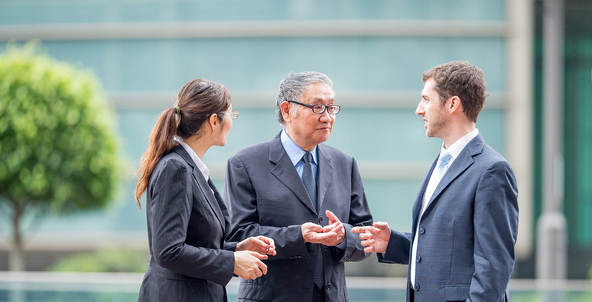 Three business people discussing